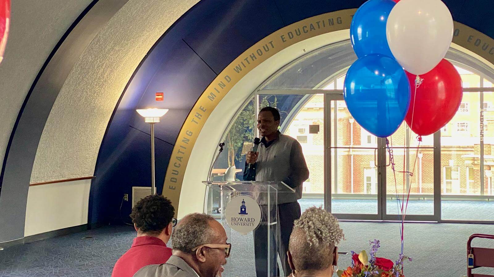 Doctor Muaka, chair of the Department of World Languages and Cultures, recognizing his colleagues.